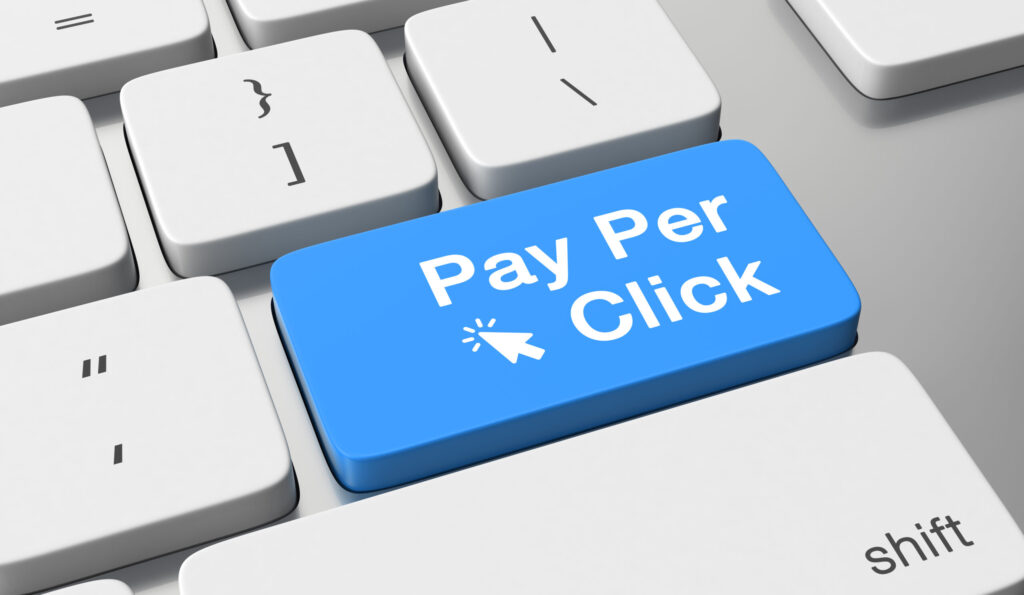 Pay Per Click advertising keyboard button representing digital marketing services for online business growth"